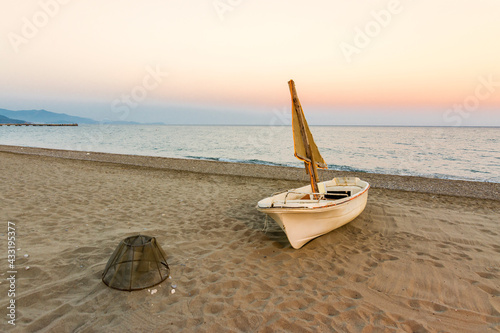 Fototapeta Naklejka Na Ścianę i Meble -  Caretta Caretta loggerhead sea turtles lay their eggs at Anamur Beach every year and boat on the beach.