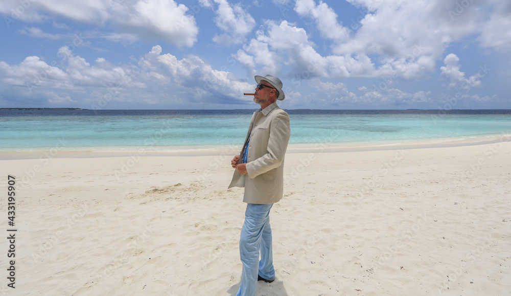 man with a cigar on a tropical island