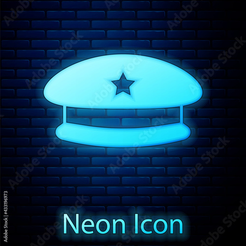 Glowing neon Military beret icon isolated on brick wall background. Soldiers cap. Army hat. War baret. Vector