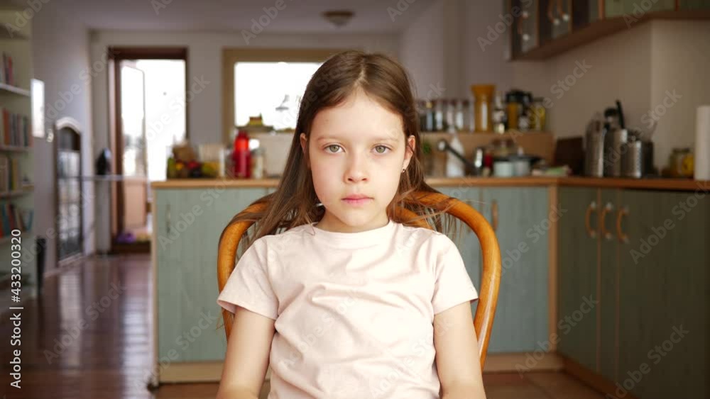 Cute little girl kid portrait sit watching to camera at home Cute little girl kid portrait sit watching to camera at home