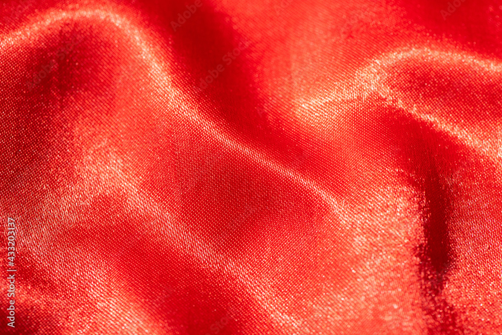 Abstract red silk fabric texture background. Cloth soft wave. Creases of satin Abstract red silk fabric texture background. Cloth soft wave. Creases of satin