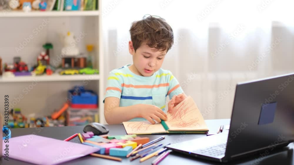 playful boy tears paper, relieves stress after class. playful boy tears paper, relieves stress after class.