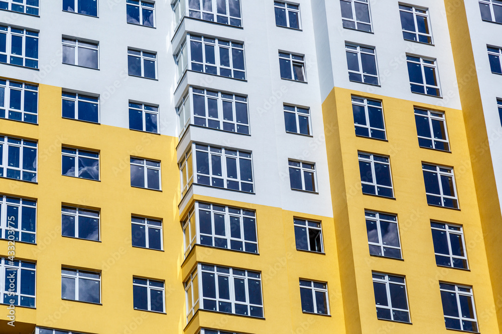 PVC windows on facade of skyscraper. Plastic double glazed windows.Textura of modern buildings, glazed financial and residential surfaces.Building exterior. PVC windows on facade of skyscraper. Plastic double glazed windows.Textura of modern buildings, glazed financial and residential surfaces.Building exterior.