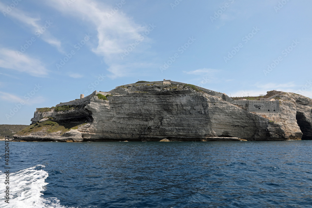 Overhanging cliff near the town of Bonifacio on the island called Corsica in the Mediterranean Sea