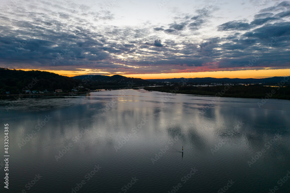 Sunrise aerial waterscape with clouds