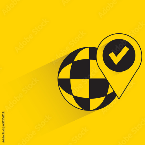 globe and pin with shadow yellow background