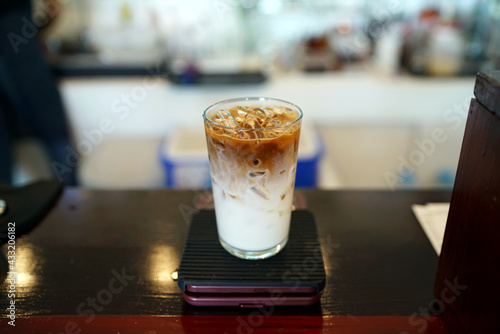 Iced Caramel Macchiato - A glass of espresso mixed with milk and vanilla syrup.