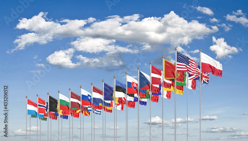 The 30 waving Flags of NATO Countries - North Atlantic Treaty. Isolated on sky background  - 3D illustration.