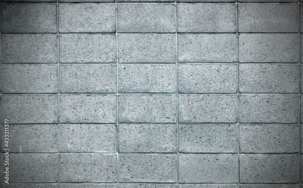 Grey color of rough texture concrete wall skin with grid pattern on cement plaster surface Grey color of rough texture concrete wall skin with grid pattern on cement plaster surface