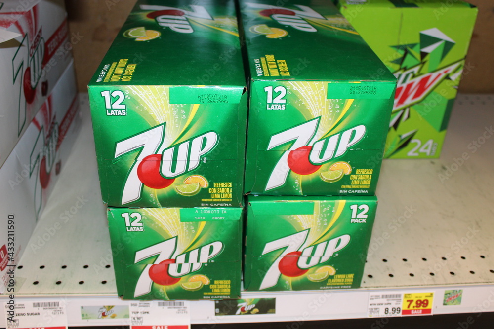 7 UP shot closeup on a metal shelf that's stacked up at a Dillons store