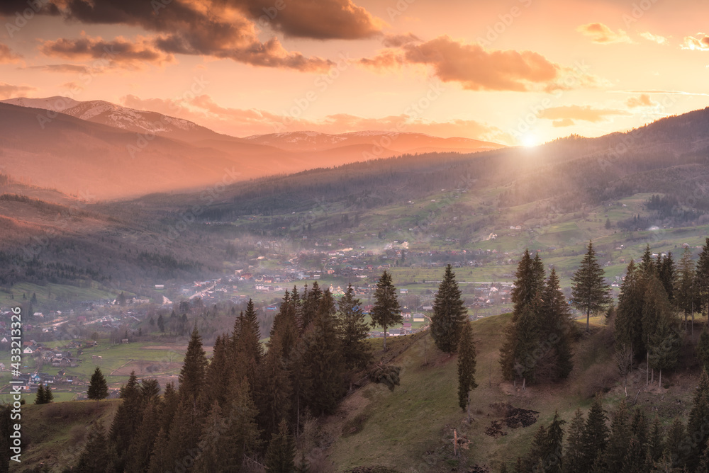Alpine carpathian valley illuminated by sunset sun