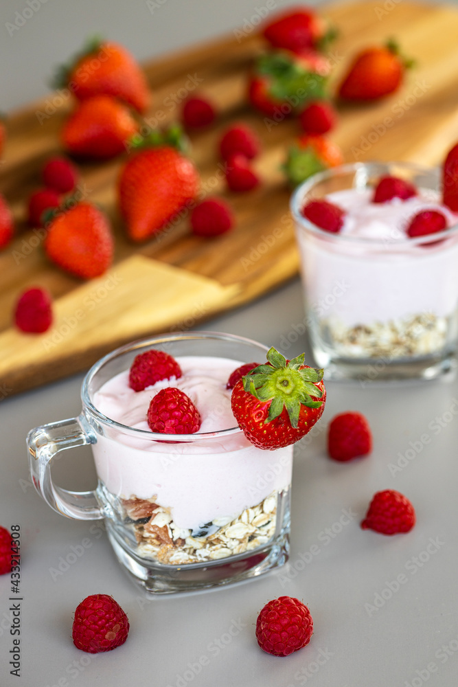 Delicious strawberry and raspberry yogurt with cereals Delicious strawberry and raspberry yogurt with cereals