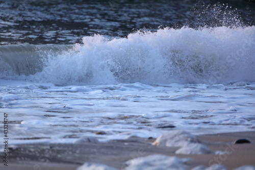 Waves breaking on the shore at Flamborough beach, East Yorkshire, UK. © Drew