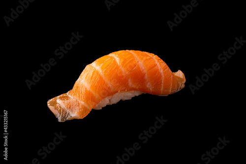 Salmon Sushi isolated on black background, Rice ball on top with Salmon sliced.