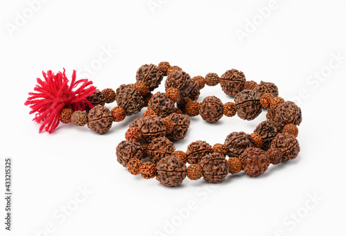 Rudraksha prayer beads for meditation on white background, top view. Japa mala photo