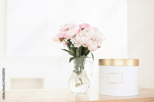 Romantic peonies on a light background. Feminine bouquet for a wedding or birthday.