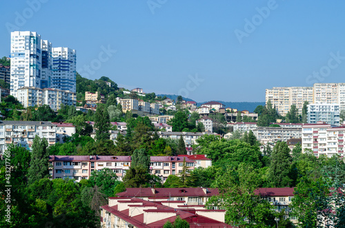 Apartment buildings in the hills. Landscape of a modern city photo