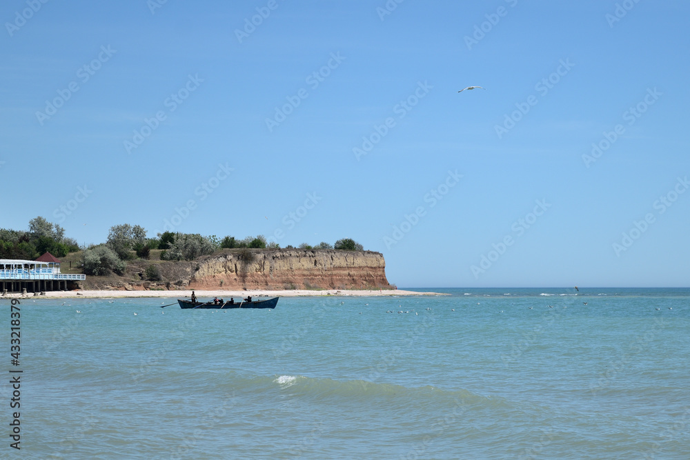 seascape with fishing boat on the sea - Olimp, Mangalia, Constanta, Romania seascape with fishing boat on the sea - Olimp, Mangalia, Constanta, Romania
