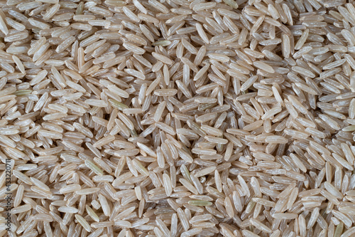 Close up of brown rice, texture background.