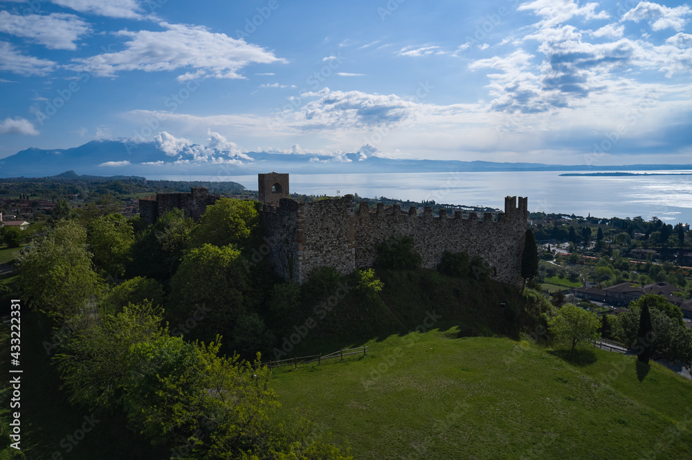 Aerial view of the historic part of Padenghe Castle on Lake Garda, Italy. Historic castles in Italy. Panorama of Lake Garda. Top view of the castle.