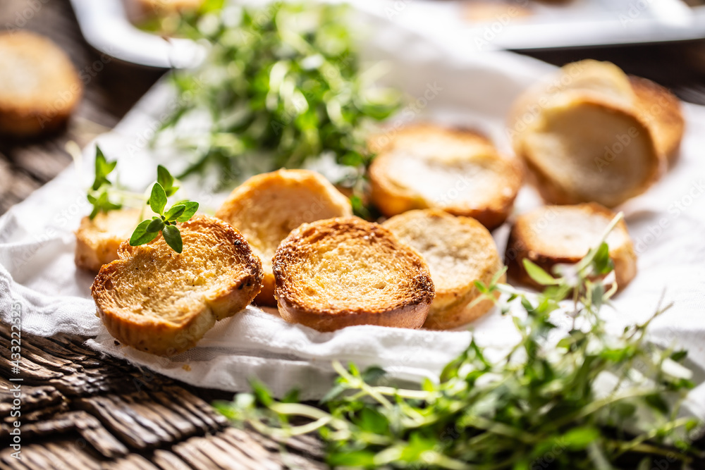 Crispy goldish bake rolls with savory flavour, served with lovely green thyme Crispy goldish bake rolls with savory flavour, served with lovely green thyme