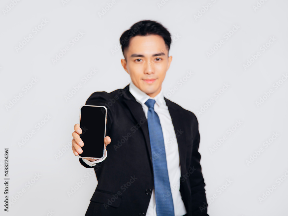 Young business man showing the mobile phone screen Young business man showing the mobile phone screen