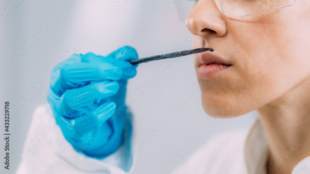 Olfaction Test. Female Scientist Examining Vanilla Smell. Olfaction Test. Female Scientist Examining Vanilla Smell.