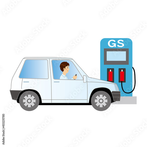 車の給油にガソリンスタンドに入るドライバー