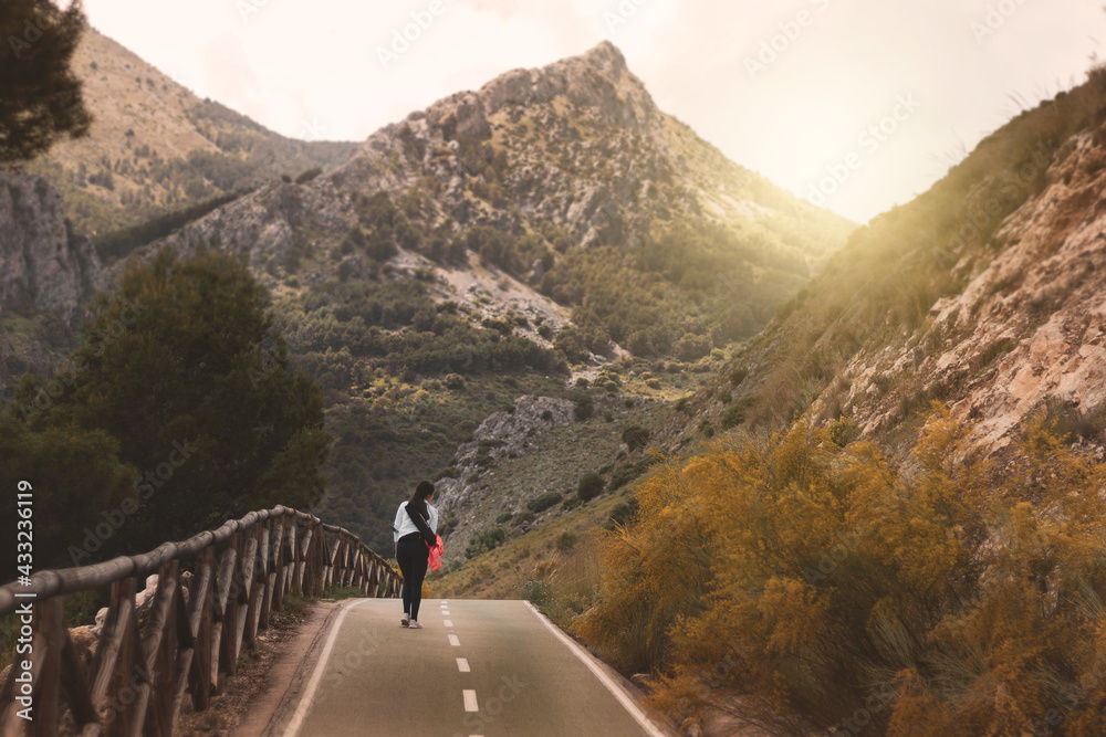 Obraz premium young man on a trip looking at a landscape. healthy lifestyle. sport.