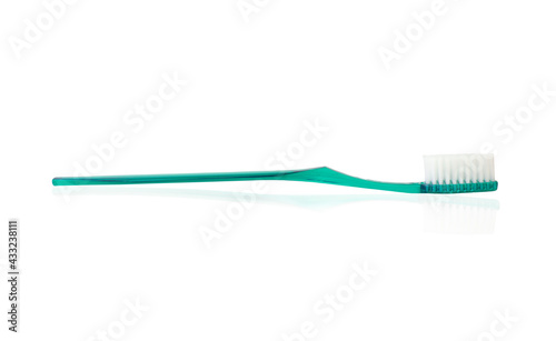 turquoise plastic toothbrush on white background