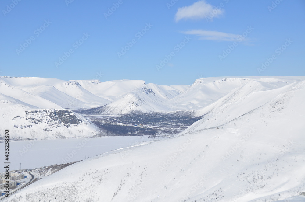 Panoramic view of snow capped landscape with hills in Khibiny, Russian Federation Panoramic view of snow capped landscape with hills in Khibiny, Russian Federation