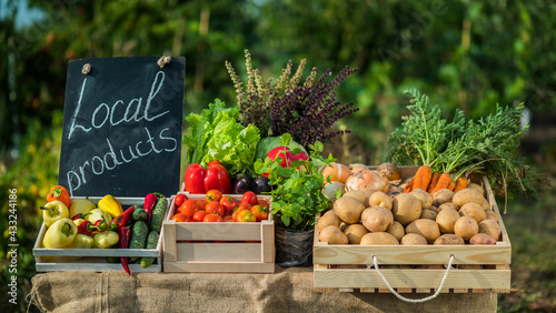 Photography A counter with fresh vegetables at a small farmers market