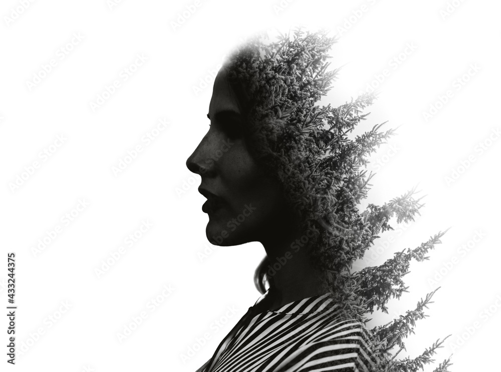 Girl in profile. Double exposure of young woman and tree.