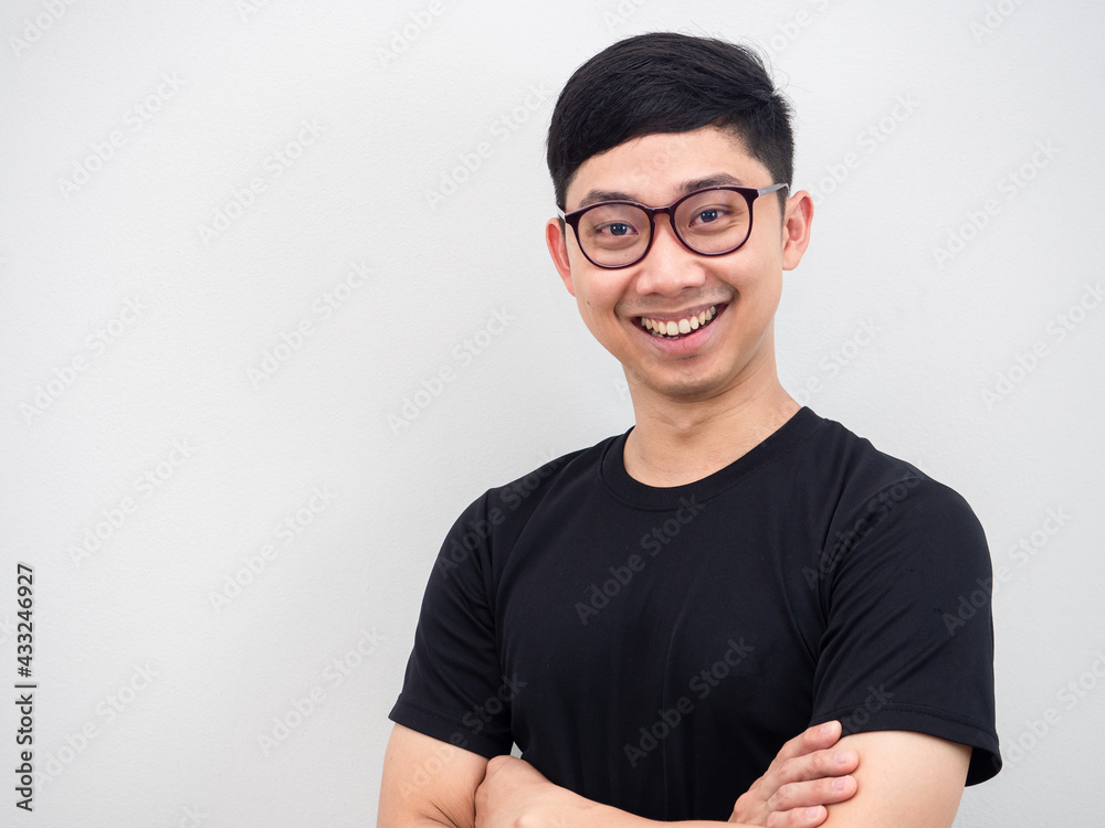 Asian man wearing glasses happy smile face portrait black shirt on white background Asian man wearing glasses happy smile face portrait black shirt on white background