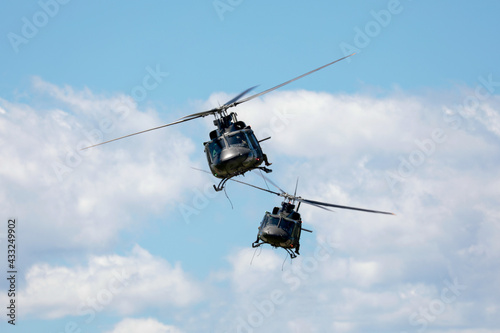Fototapeta Naklejka Na Ścianę i Meble -  Two army helicopter in flight