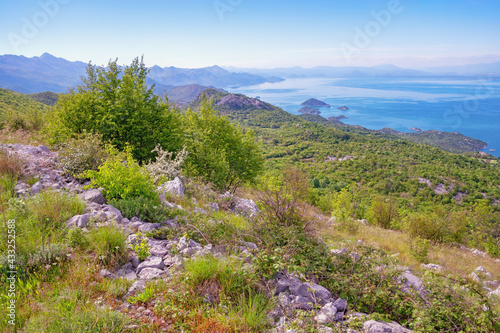 Beautiful sunny spring landscape in mountains, coast of lake. Montenegro. National Park Lake Skadar