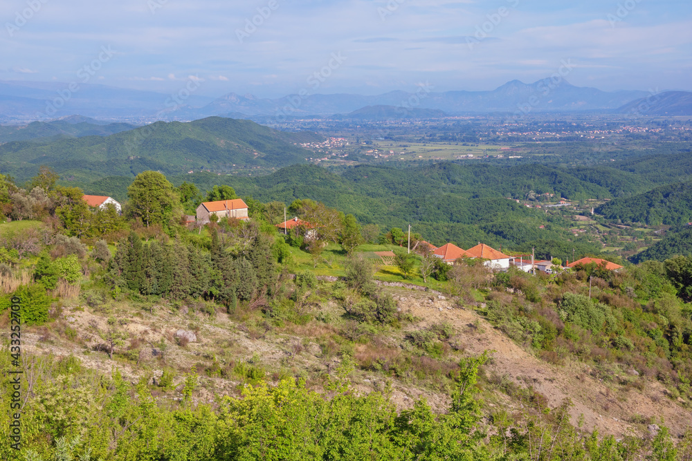 Beautiful panoramic mountain landscape with small village on sunny spring day.  Montenegro, Ulcinj Municipality