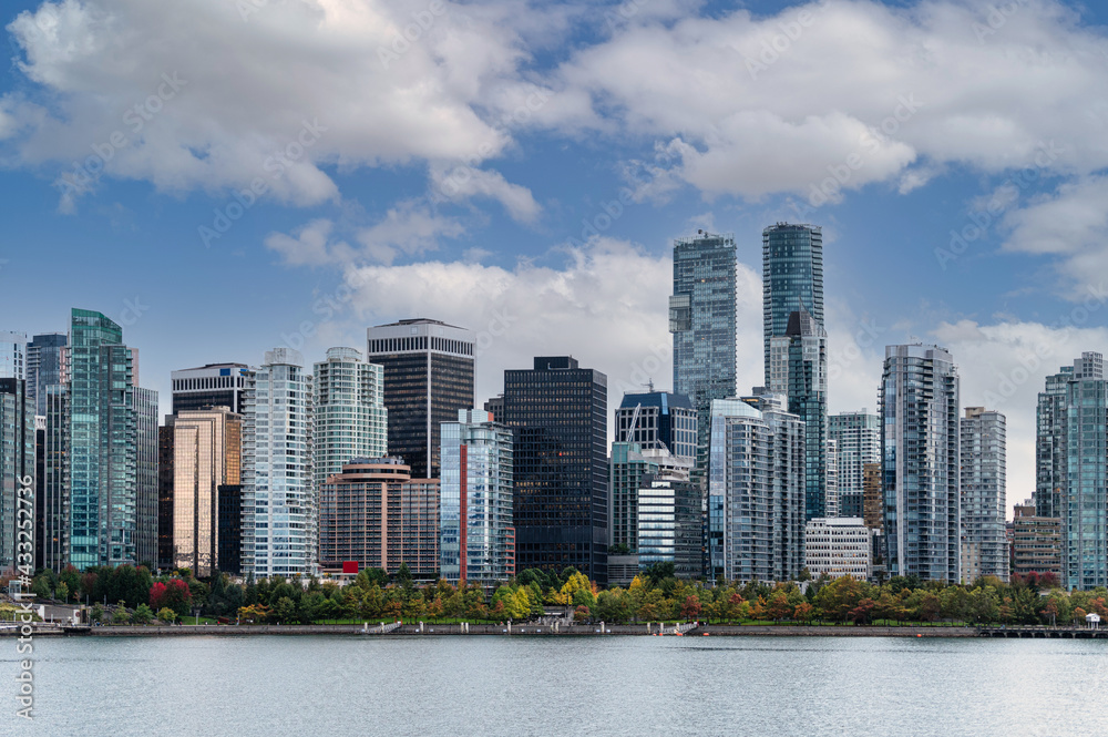Cityscape of Crowded business buildings and blue sky on coastline in downtown at Stanley Park, Vancouver Cityscape of Crowded business buildings and blue sky on coastline in downtown at Stanley Park, Vancouver