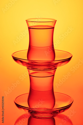 Composition of traditional Turkish tea glasses with pomegranate tea