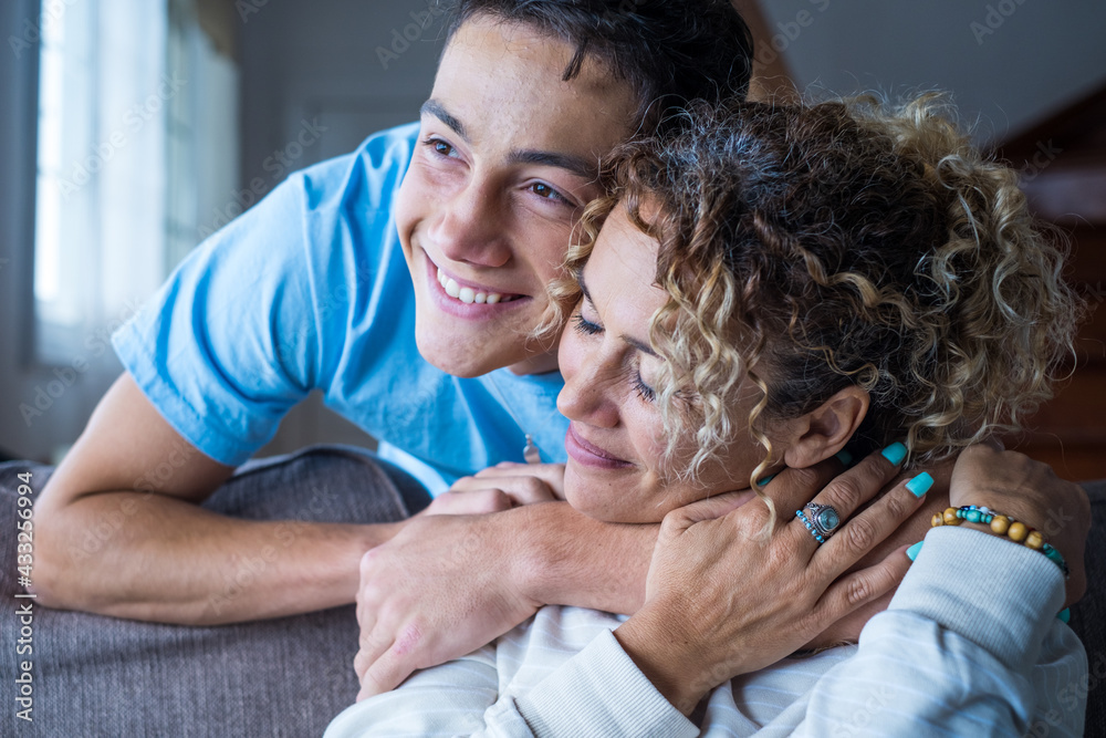 Portrait of middle age mother spend time with teenager son, relatives people hugging at home, adult attentive millennial grateful child wrapped in a plaid or warm sweater loving mommy caring
Portrait of middle age mother spend time with teenager son, relatives people hugging at home, adult attentive millennial grateful child wrapped in a plaid or warm sweater loving mommy caring