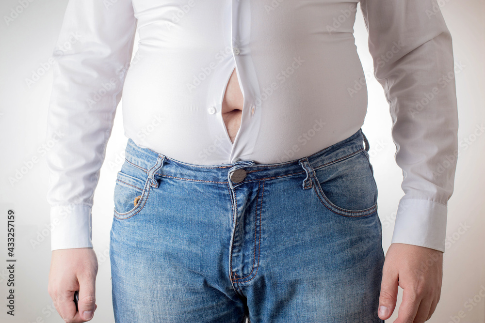 A fat man in a small, tight white shirt. Uncomfortable clothing concept,  obesity. Slimming Stock-Foto | Adobe Stock