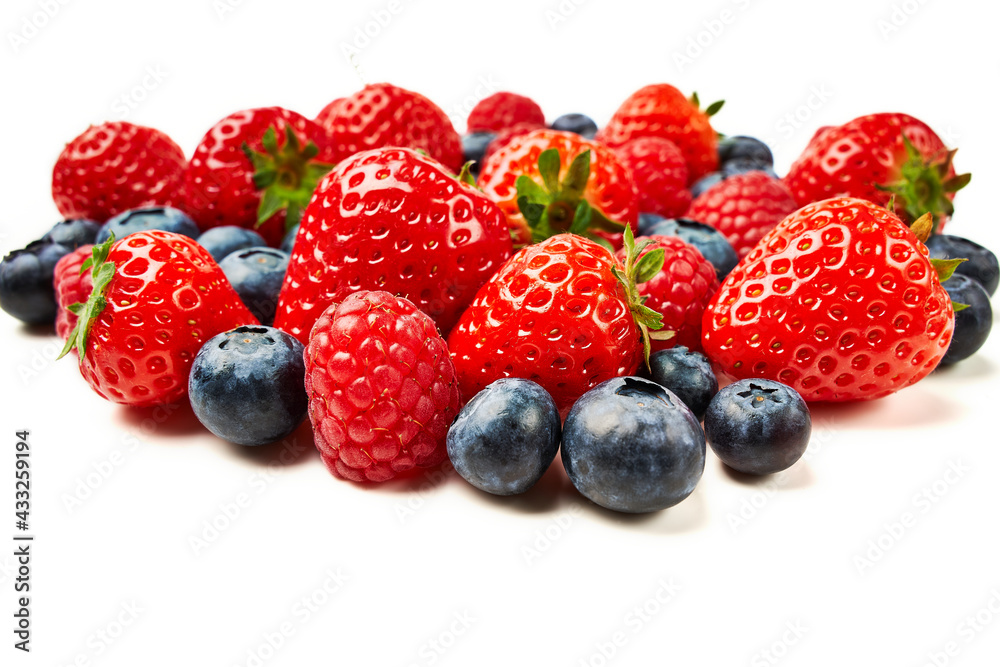 Strawberries, raspberries and blueberries on a white background. Strawberries, raspberries and blueberries on a white background.