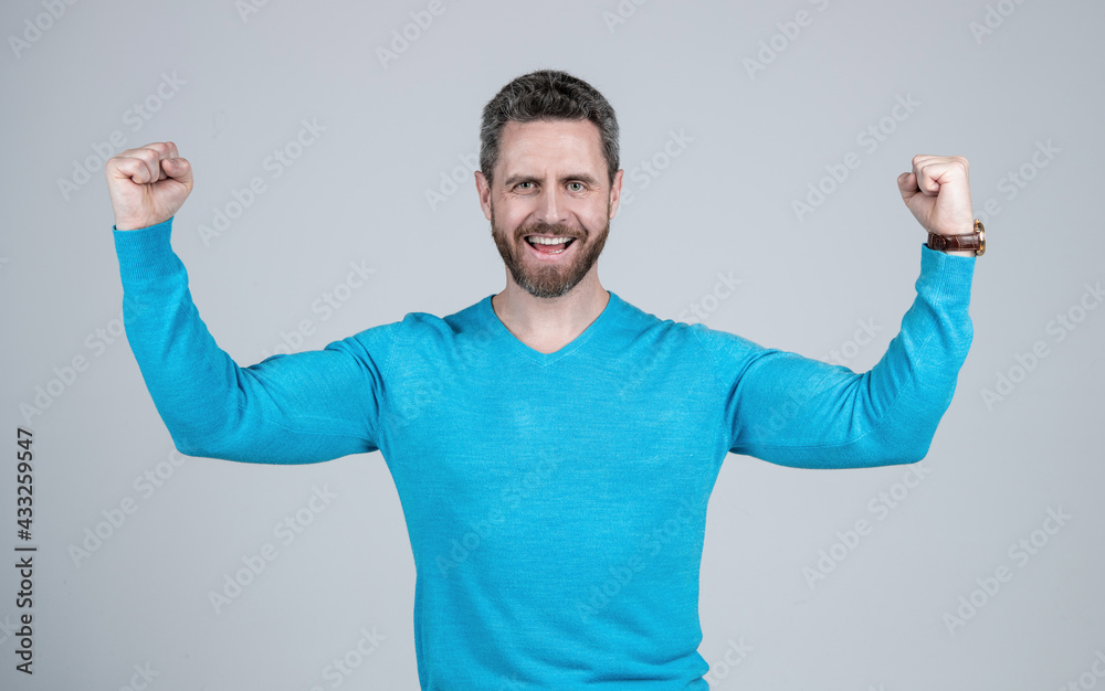 happy mature man with beard show power on grey background, strength happy mature man with beard show power on grey background, strength