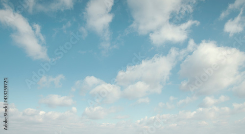 Canvas Print Blue sky with white fluffy clouds