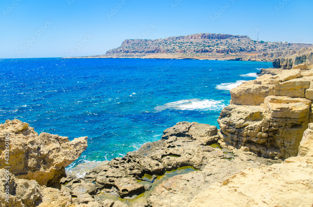 Seascape, sea waves break on the rocks, Cyprus, Cape Kavo Greko