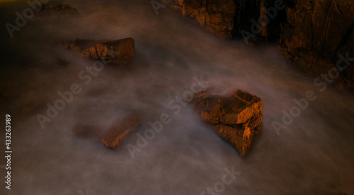 Time-lapse photography of the rocks on the beach