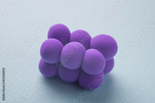 closeup of a pyogenic streptococcus model, against a blue background. photo