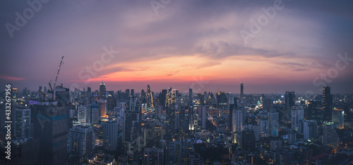 Panoramic modern cityscape building bird eye aerial view to the skylne under sunset in Bangkok, Thailand. Asia Business concept for real estate.