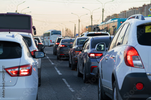 Background, blur, out of focus, bokeh. Traffic jams during rush hours after work. Red brake lights of stopped cars on the background of the city neighborhood. © Андрей Михайлов