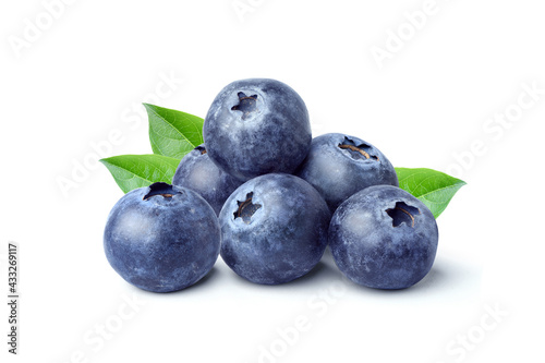 Pile of Blueberries fruits with leaves isolated on white background